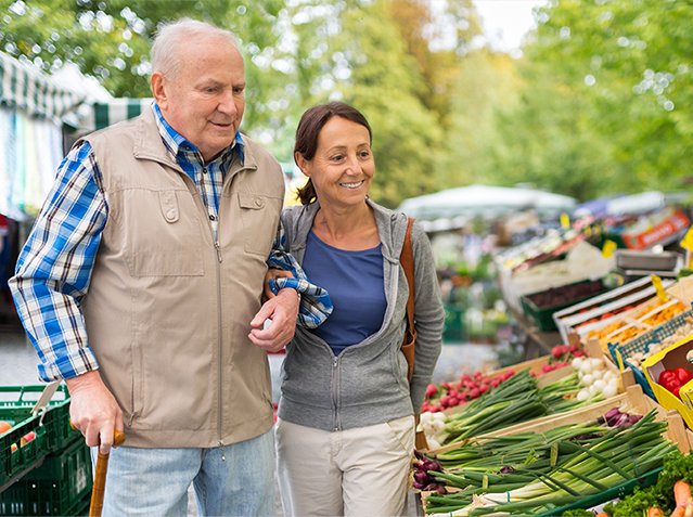 494831978 Senior man with caregiver shopping